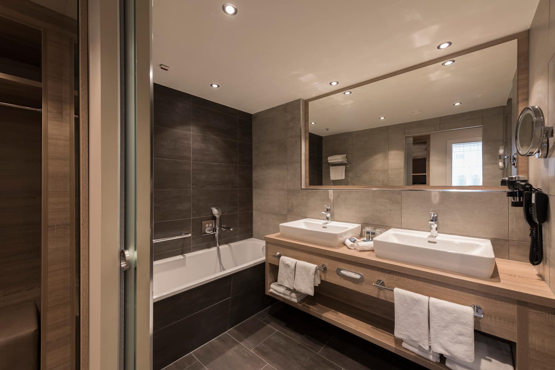 Guest room bath at the Wyndham Grand Salzburg Conference Centre in Salzburg, Other than US/Canada