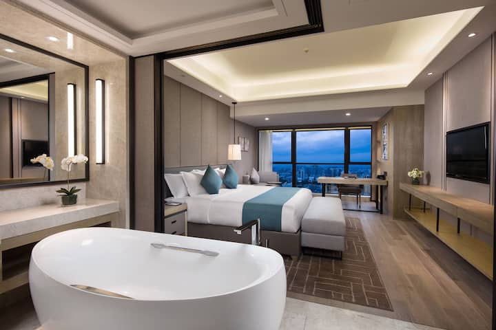 Guest room at the Wyndham Grand Maoming in Maoming, Other than US/Canada