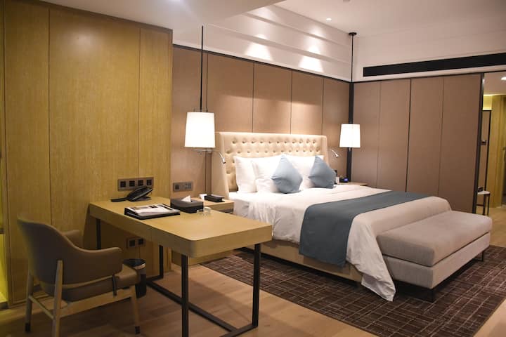 Guest room at the Wyndham Grand Maoming in Maoming, Other than US/Canada