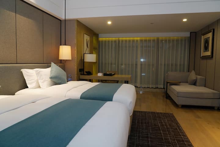 Guest room at the Wyndham Grand Maoming in Maoming, Other than US/Canada