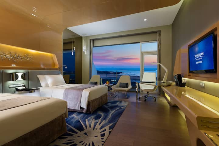 Guest room at the Wyndham Grand Qingdao in Qingdao, Other than US/Canada