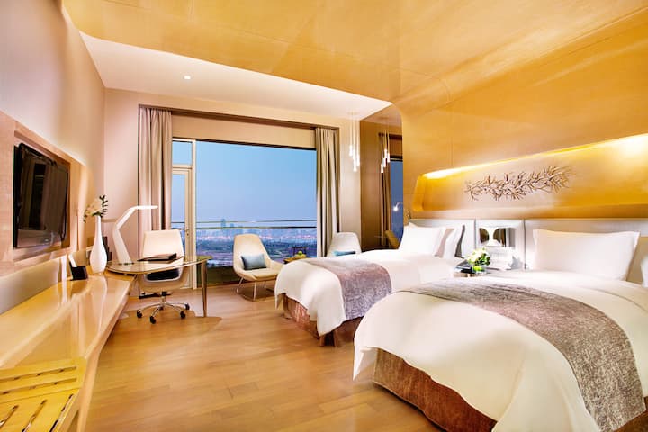 Guest room at the Wyndham Grand Qingdao in Qingdao, Other than US/Canada