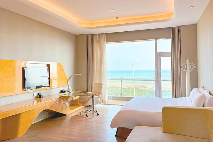Guest room at the Wyndham Grand Qingdao in Qingdao, Other than US/Canada