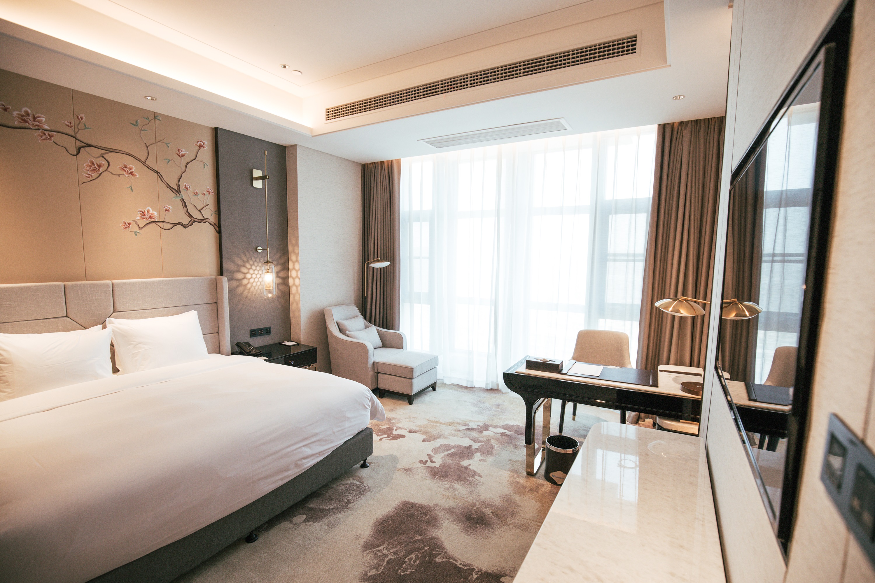 Guest room at the Wyndham Grand Taixing Downtown in Taixing, Other than US/Canada