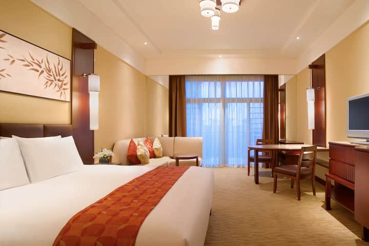 Guest room at the Wyndham Grand Tianjin Jingjin City in Tianjin, Other than US/Canada