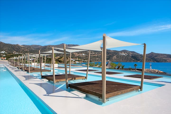Pool bar at the Wyndham Grand Crete Mirabello Bay in Agios Nikolaos, Other than US/Canada