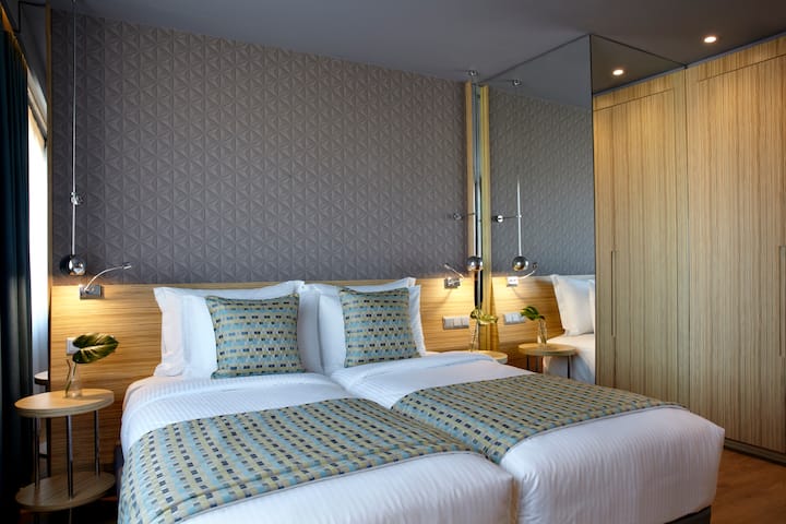 Guest room at the Wyndham Grand Athens in Athens, Other than US/Canada