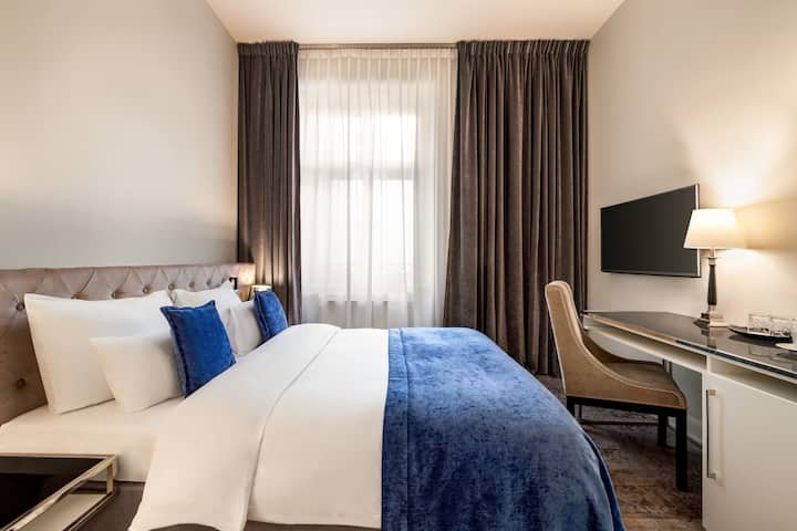 Guest room at the Wyndham Grand Krakow Old Town in Cracow, Other than US/Canada