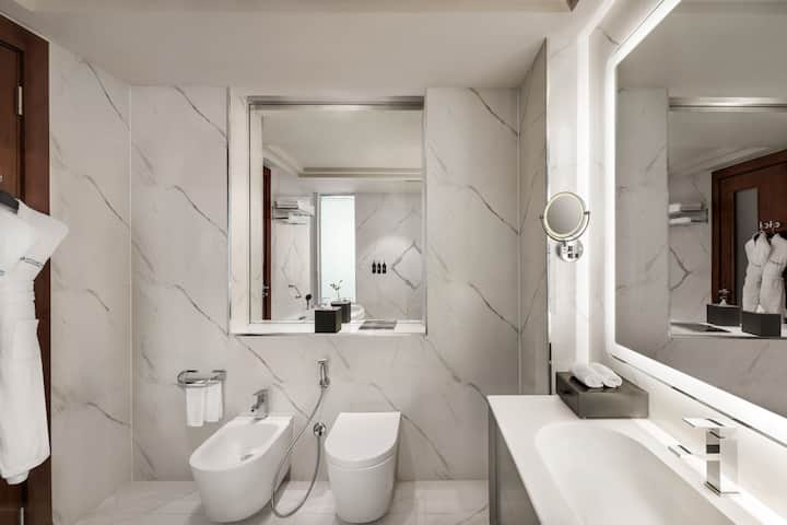 Guest room bath at the Wyndham Grand Doha West Bay Beach in Doha, Other than US/Canada