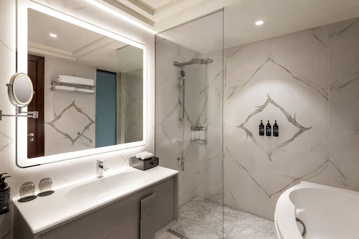 Guest room bath at the Wyndham Grand Doha West Bay Beach in Doha, Other than US/Canada