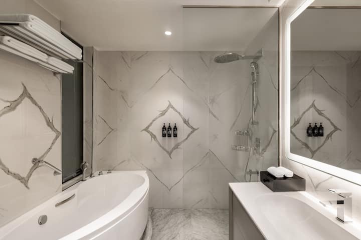 Guest room bath at the Wyndham Grand Doha West Bay Beach in Doha, Other than US/Canada