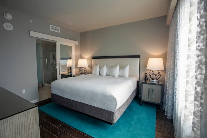 Guest room at the Wyndham Grand Jupiter at Harbourside Place in Jupiter, Florida
