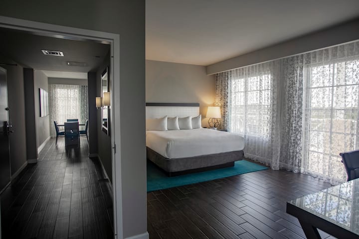Guest room at the Wyndham Grand Jupiter at Harbourside Place in Jupiter, Florida