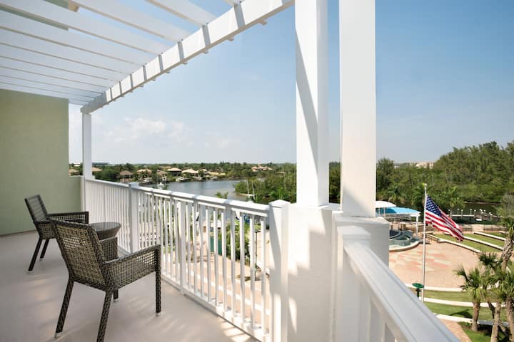 Guest room at the Wyndham Grand Jupiter at Harbourside Place in Jupiter, Florida