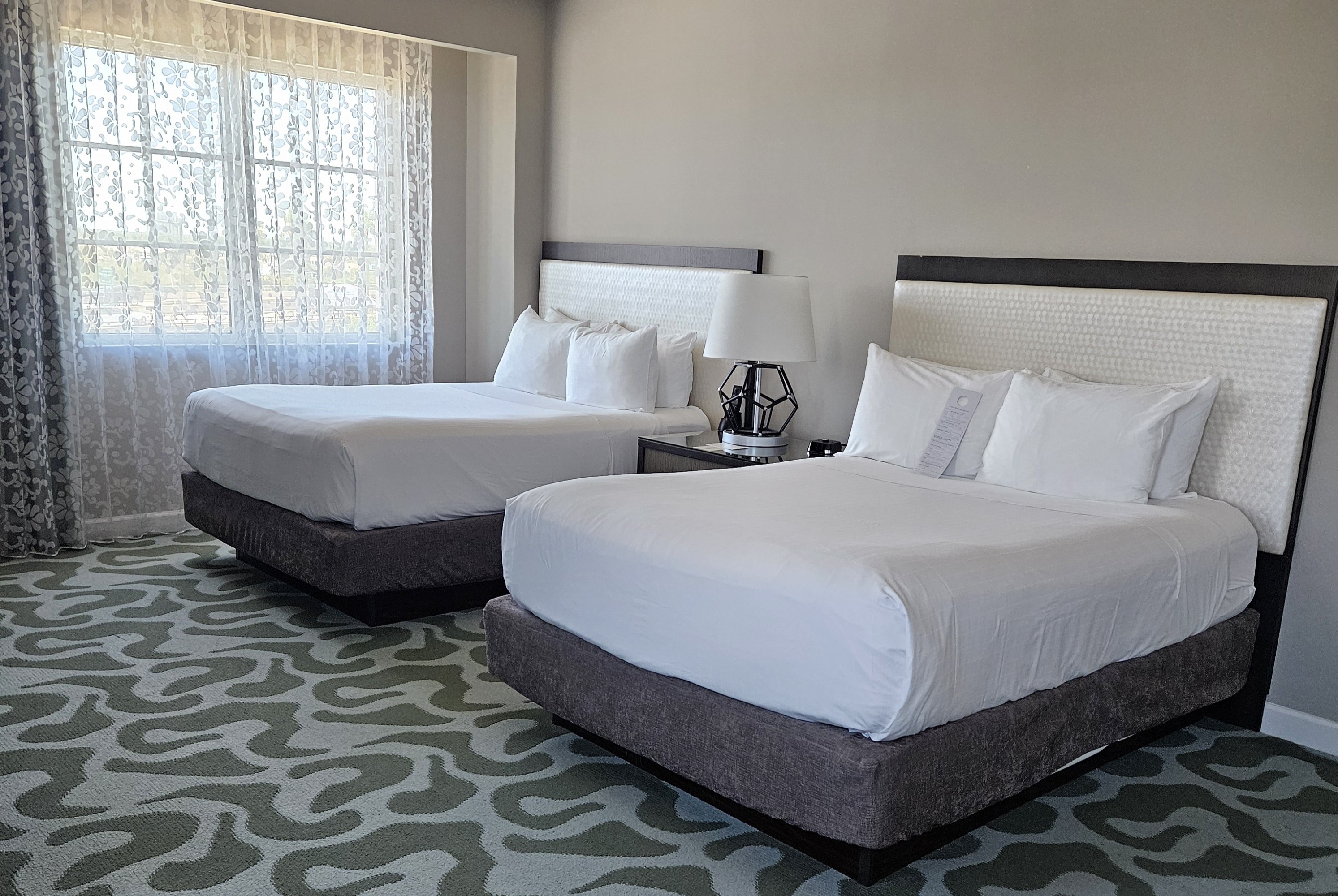 Guest room at the Wyndham Grand Jupiter at Harbourside Place in Jupiter, Florida