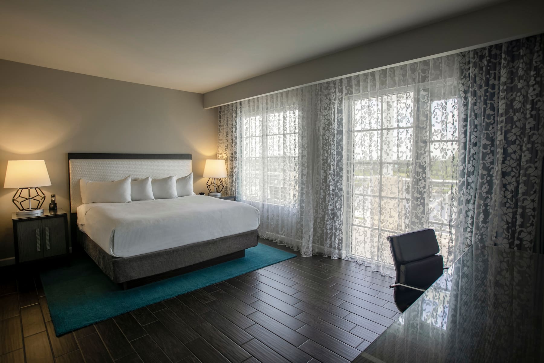 Guest room at the Wyndham Grand Jupiter at Harbourside Place in Jupiter, Florida