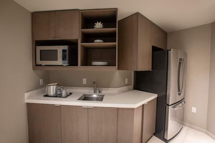 Guest room at the Wyndham Grand Jupiter at Harbourside Place in Jupiter, Florida