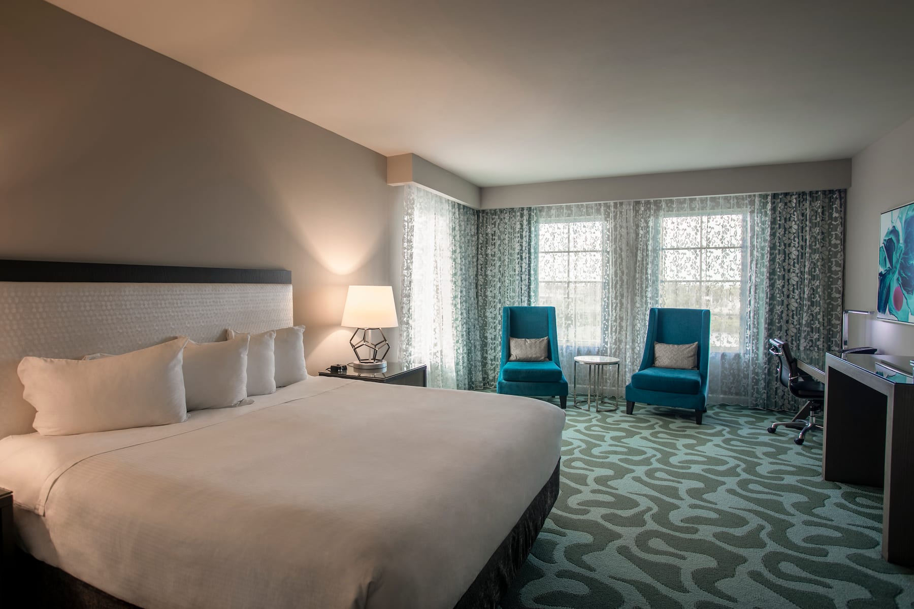 Guest room at the Wyndham Grand Jupiter at Harbourside Place in Jupiter, Florida