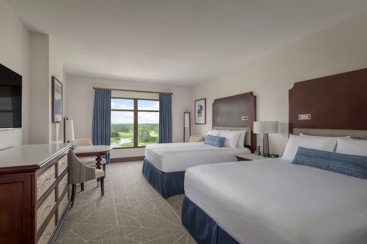 Guest room at the Wyndham Grand Orlando Resort Bonnet Creek in Orlando, Florida