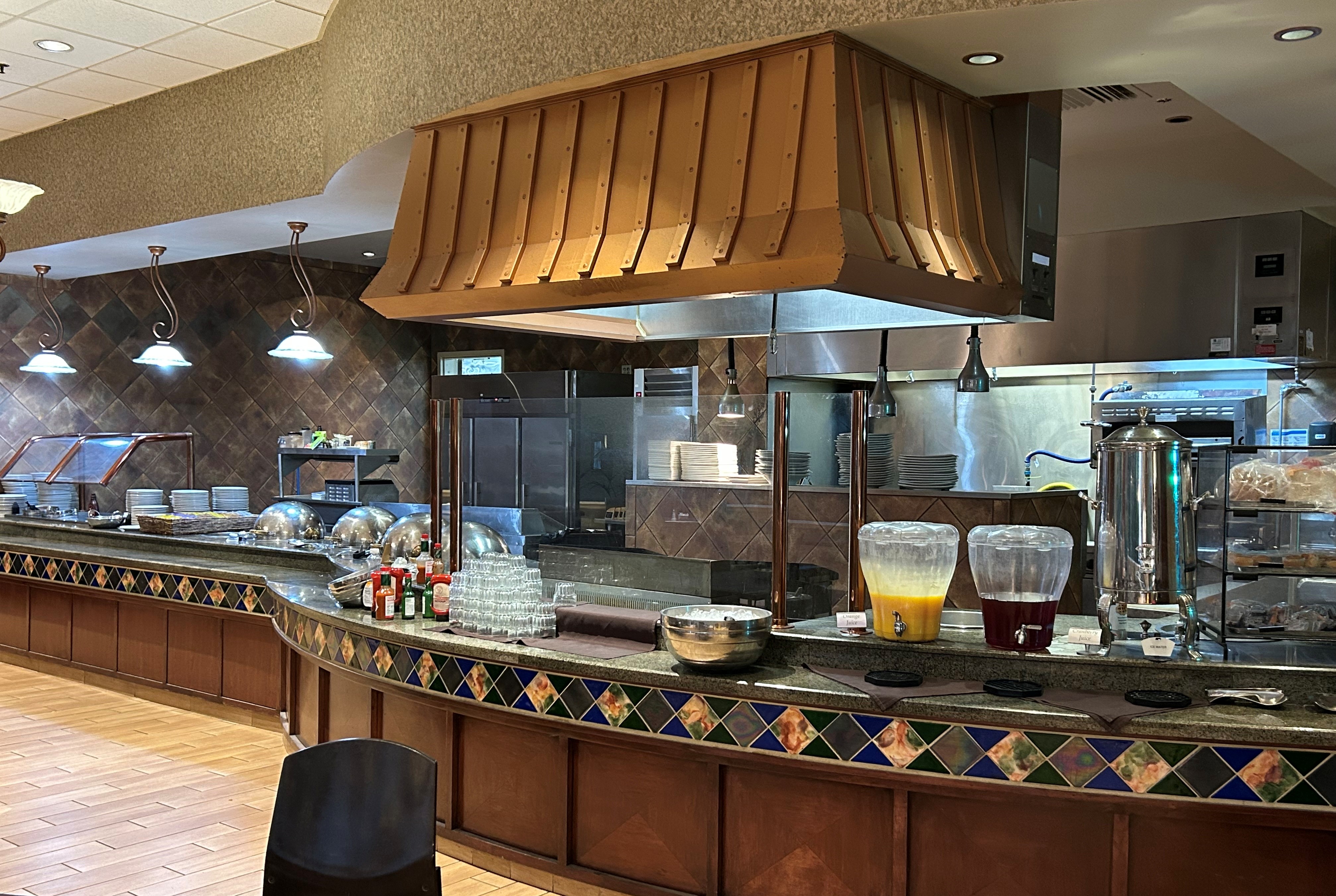 Wyndham Grand Topeka Executive Center restaurant breakfast area with seating in Topeka, Kansas