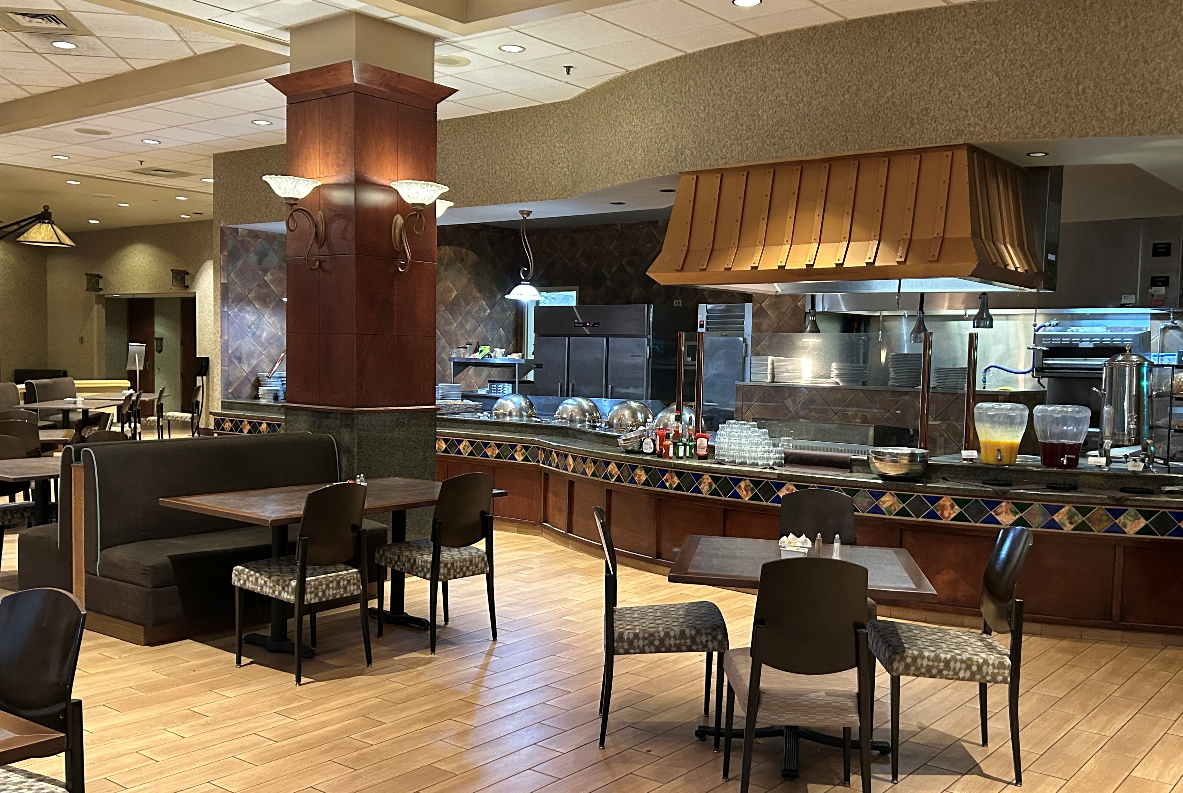 Wyndham Grand Topeka Executive Center restaurant breakfast area with seating in Topeka, Kansas