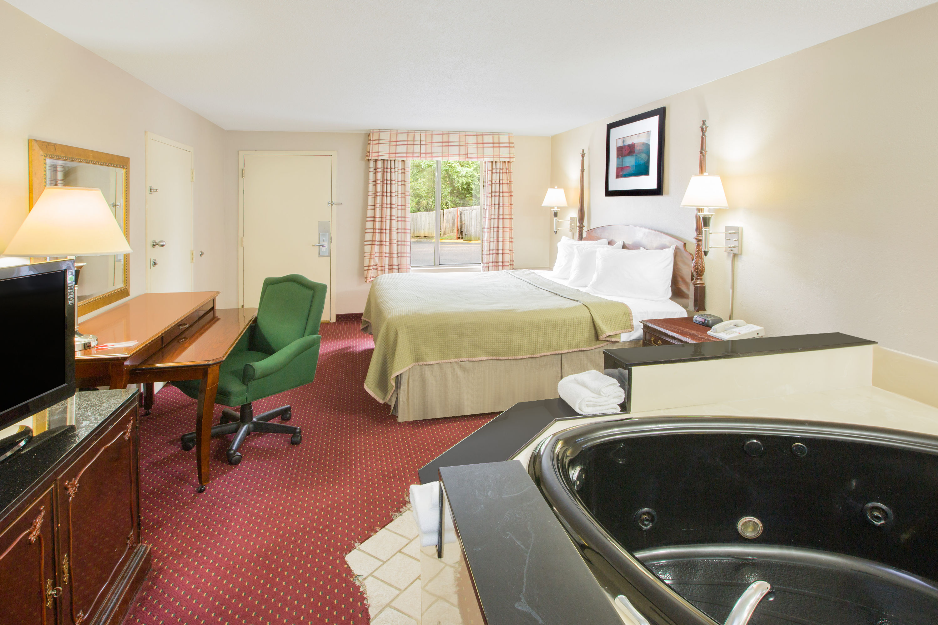Guest room at the Howard Johnson by Wyndham Dothan in Dothan, Alabama