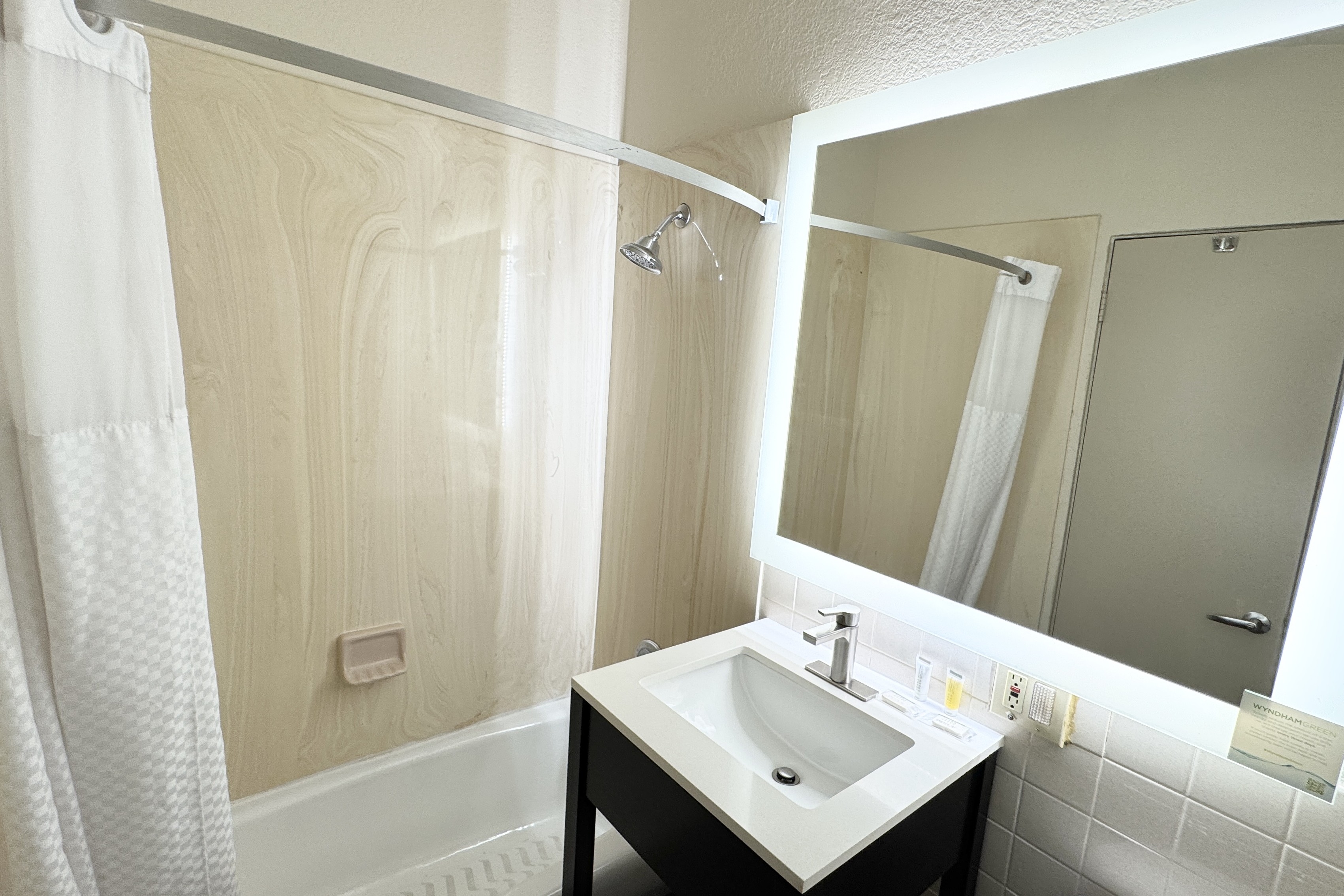 Guest room bath at the Howard Johnson by Wyndham Phoenix Airport/Downtown Area in Phoenix, Arizona