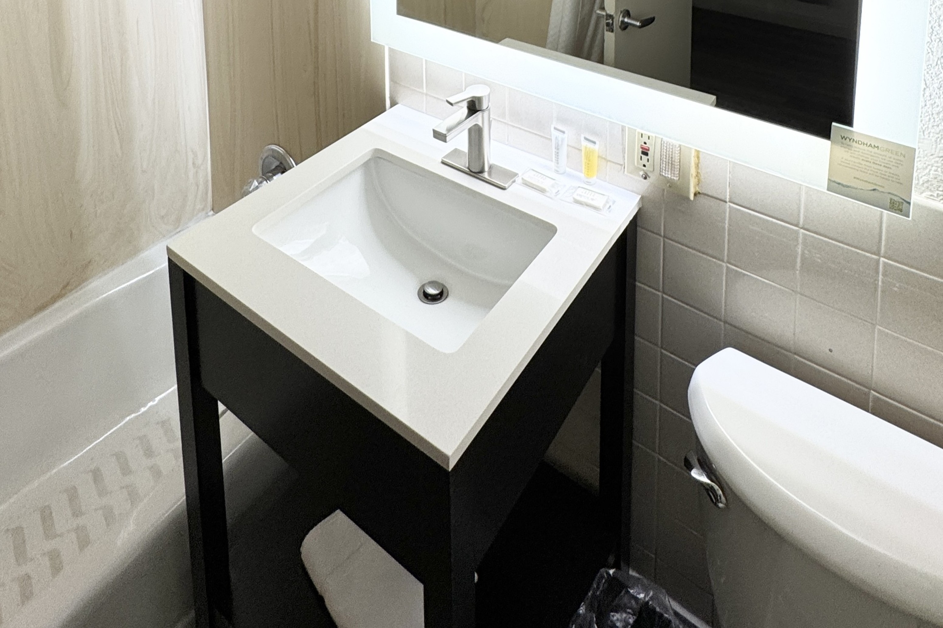 Guest room bath at the Howard Johnson by Wyndham Phoenix Airport/Downtown Area in Phoenix, Arizona