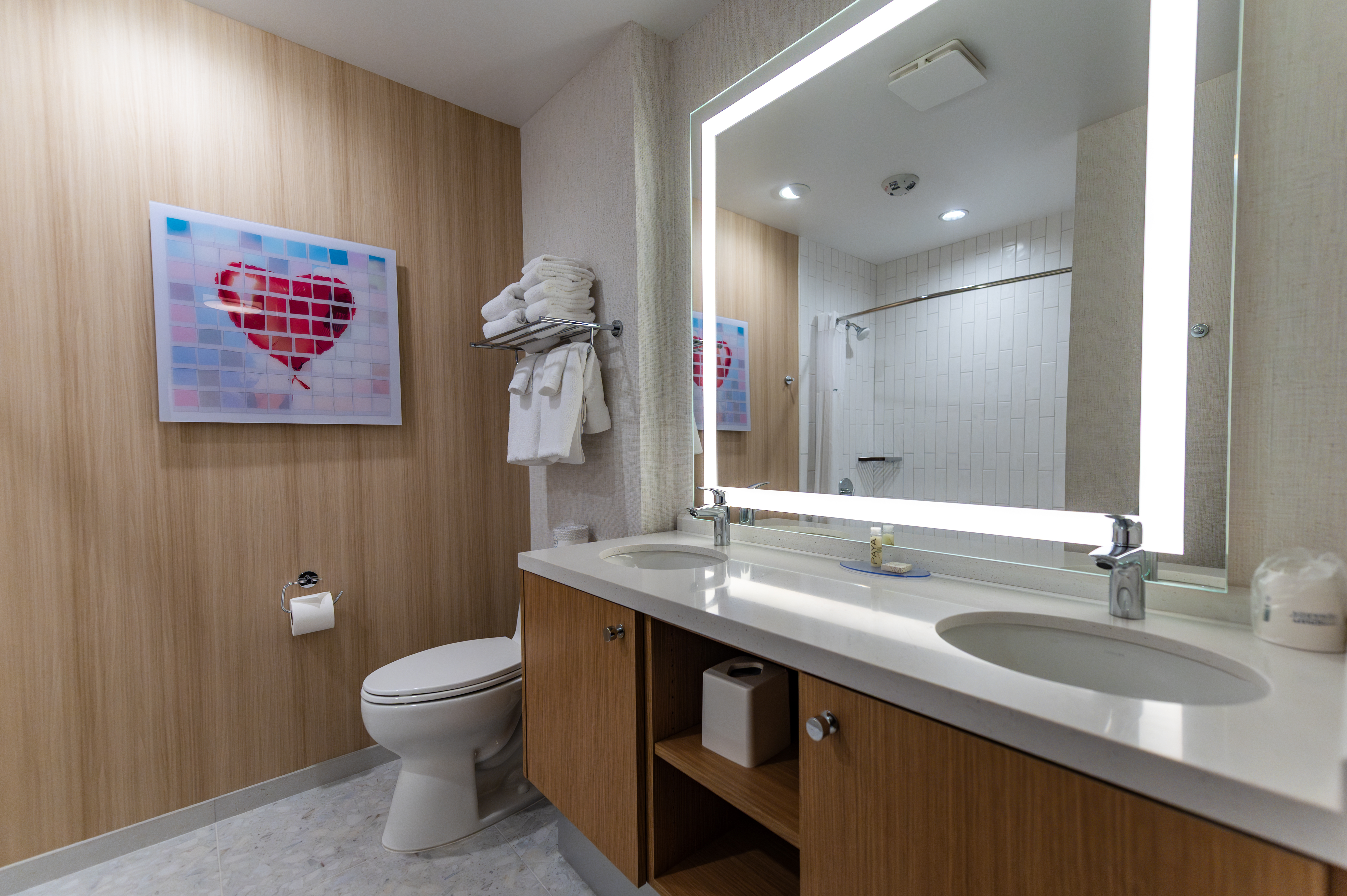 Guest room bath at the Howard Johnson by Wyndham Anaheim Hotel and Water Playground in Anaheim, California