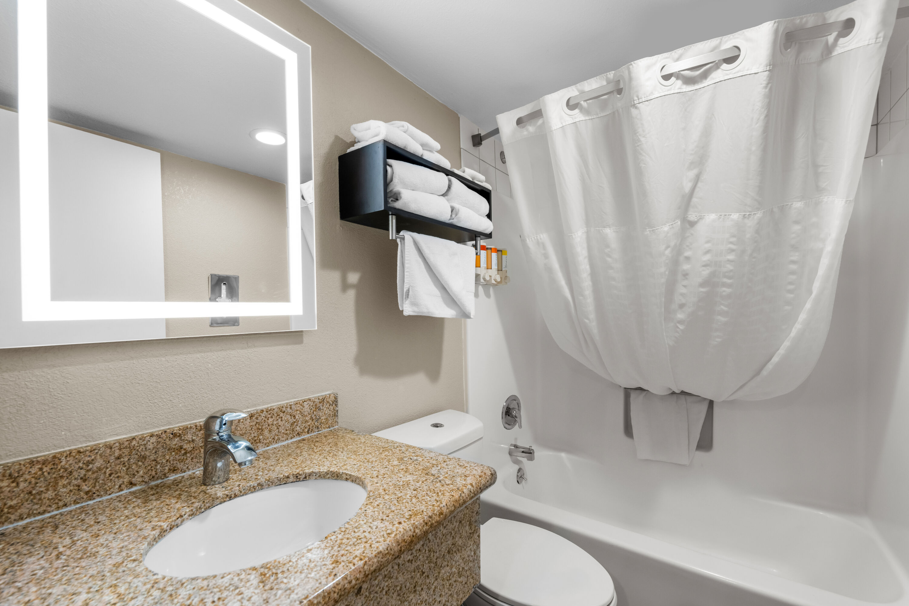 Guest room bath at the Howard Johnson by Wyndham Santa Cruz in Santa Cruz, California