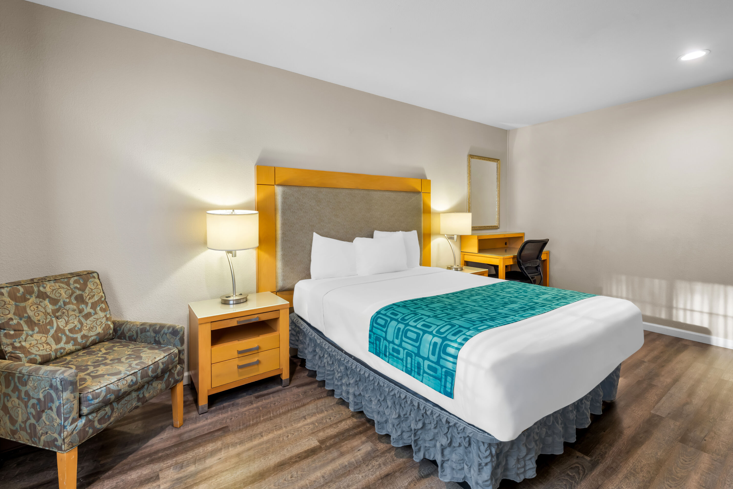 Queen bed guest room at the Howard Johnson by Wyndham Santa Cruz in Santa Cruz, California