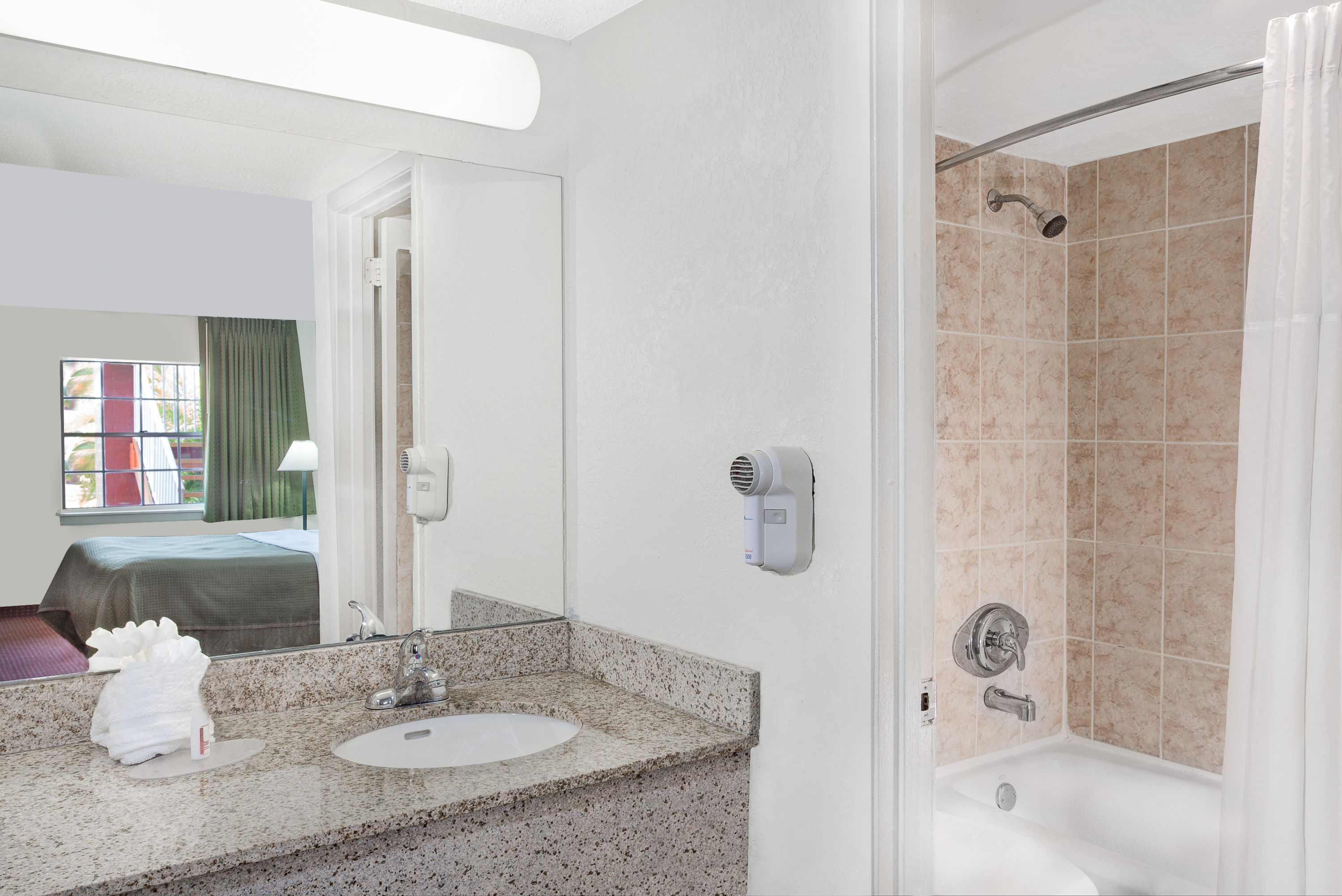 Guest room bath at the Howard Johnson by Wyndham Ft. Myers FL in Fort Myers, Florida