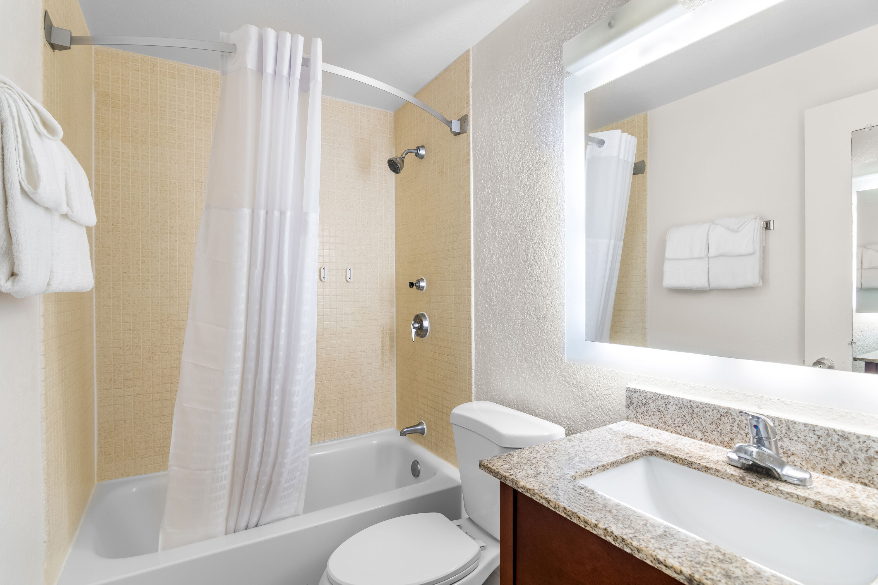 Guest room bath at the Howard Johnson by Wyndham Vero Beach / Downtown in Vero Beach, Florida