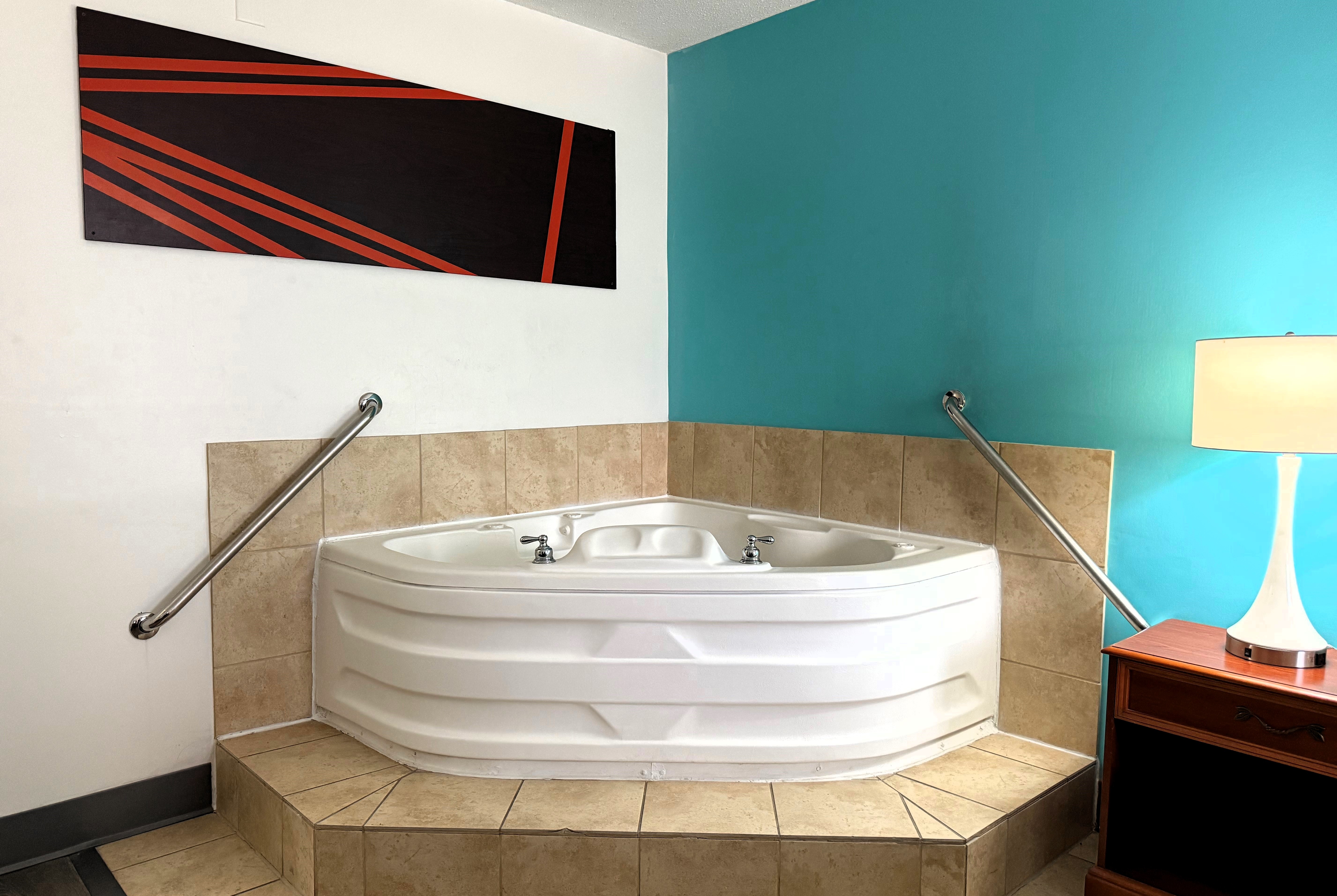 Guest room at the Howard Johnson by Wyndham Evansville East in Evansville, Indiana