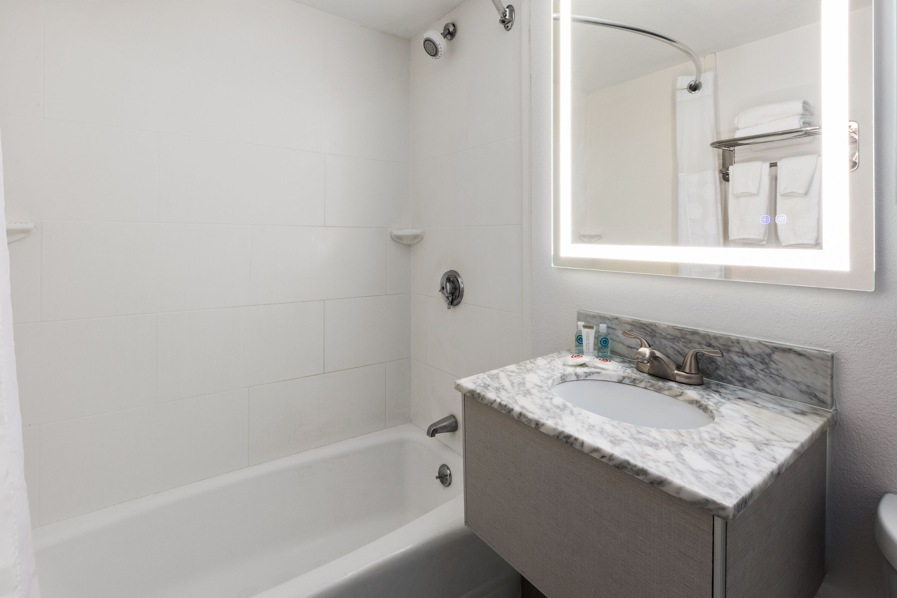 Guest room bath at the Howard Johnson by Wyndham Malden Boston Area in Malden, Massachusetts