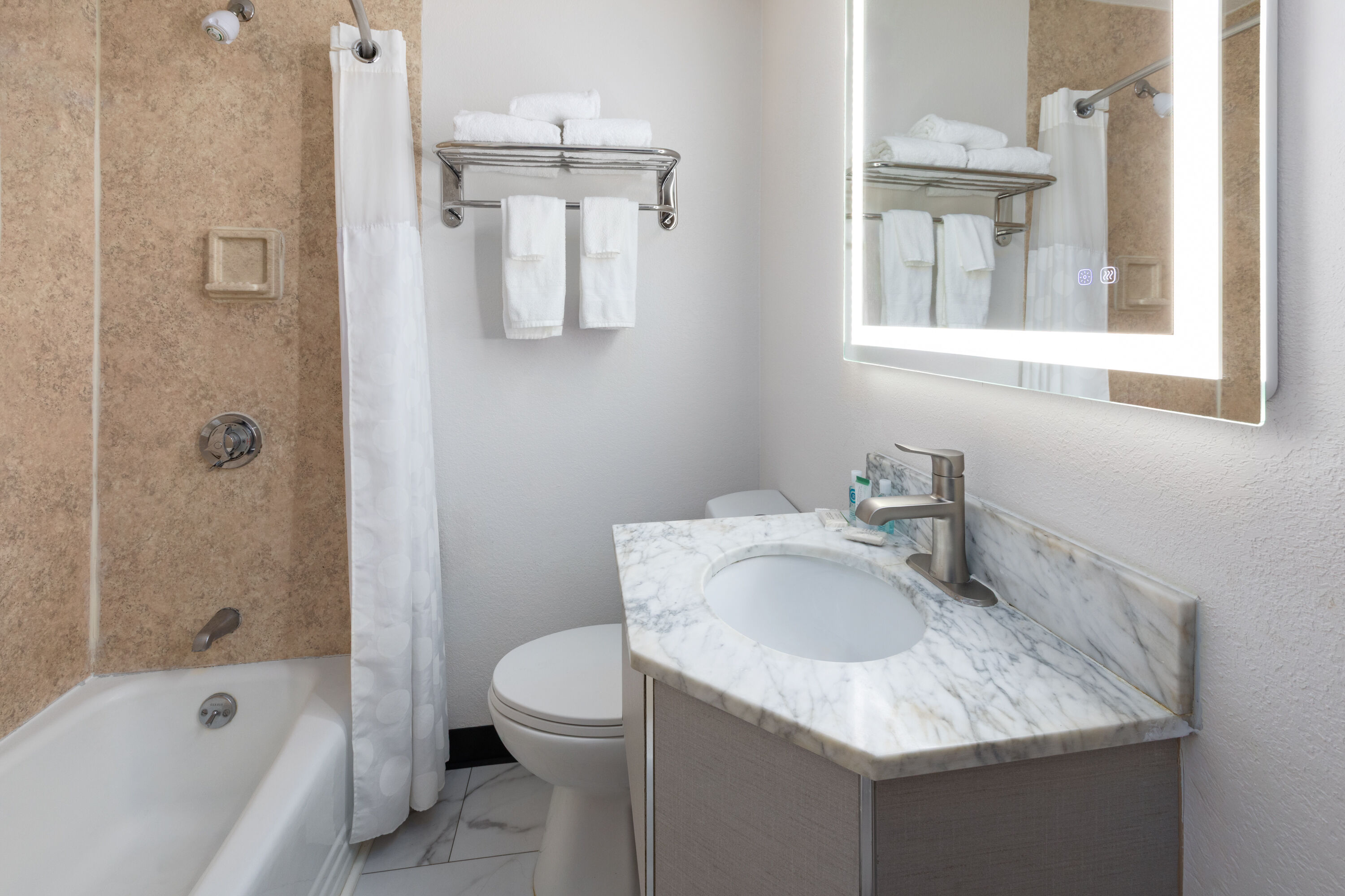 Guest room bath at the Howard Johnson by Wyndham Malden Boston Area in Malden, Massachusetts