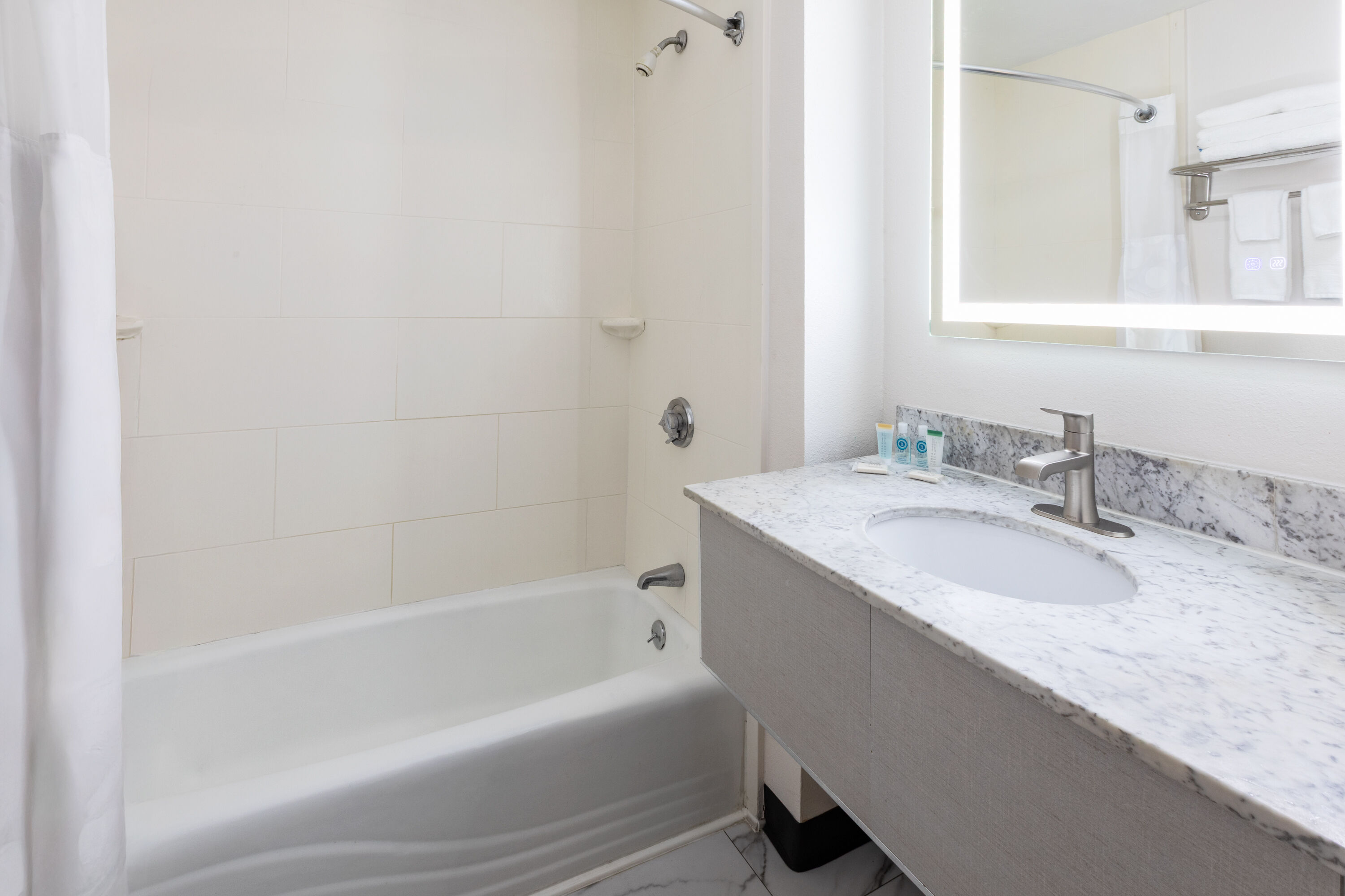 Guest room bath at the Howard Johnson by Wyndham Malden Boston Area in Malden, Massachusetts