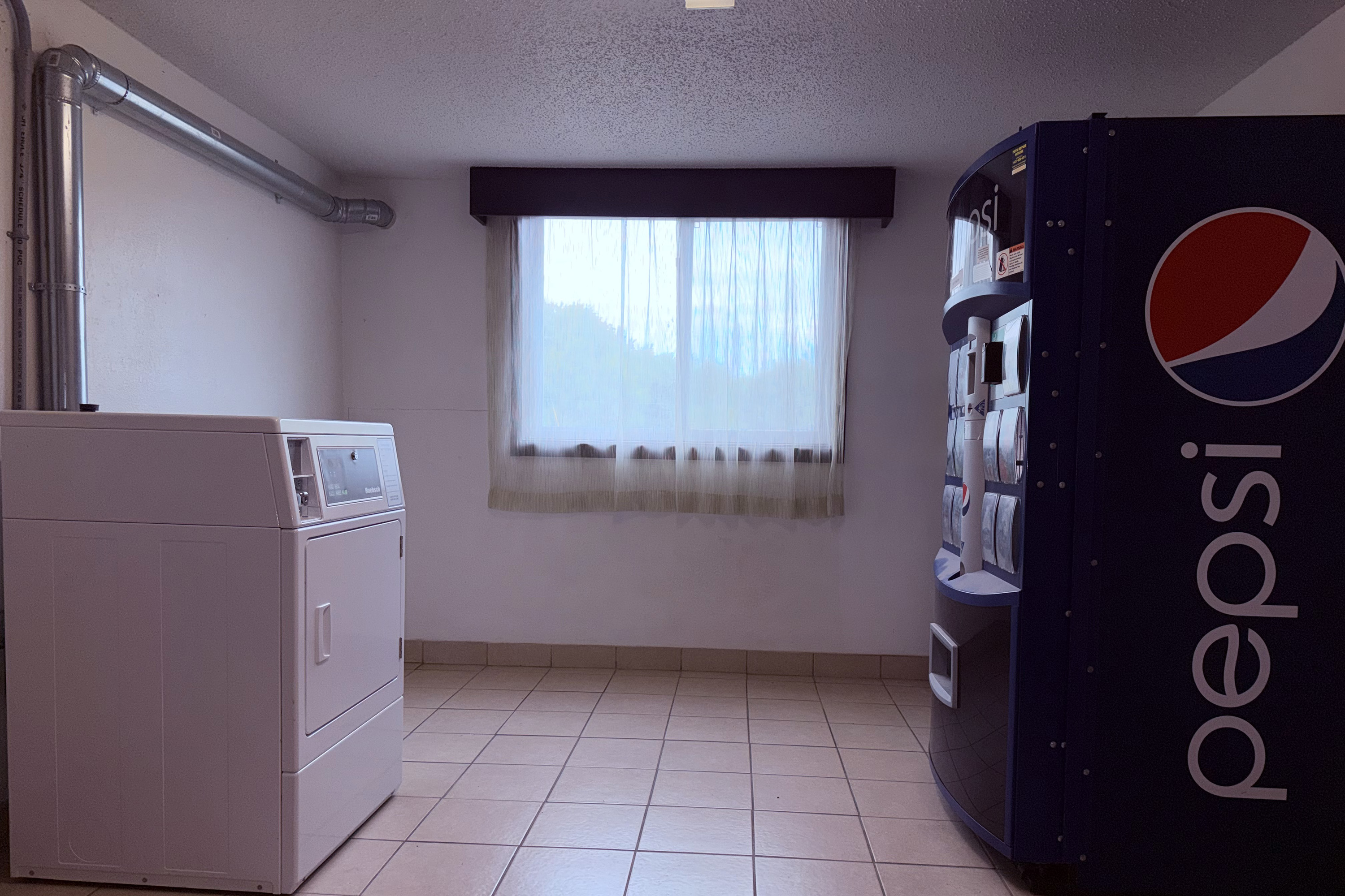 Laundry facilities at Howard Johnson by Wyndham Albert Lea in Albert Lea, Minnesota