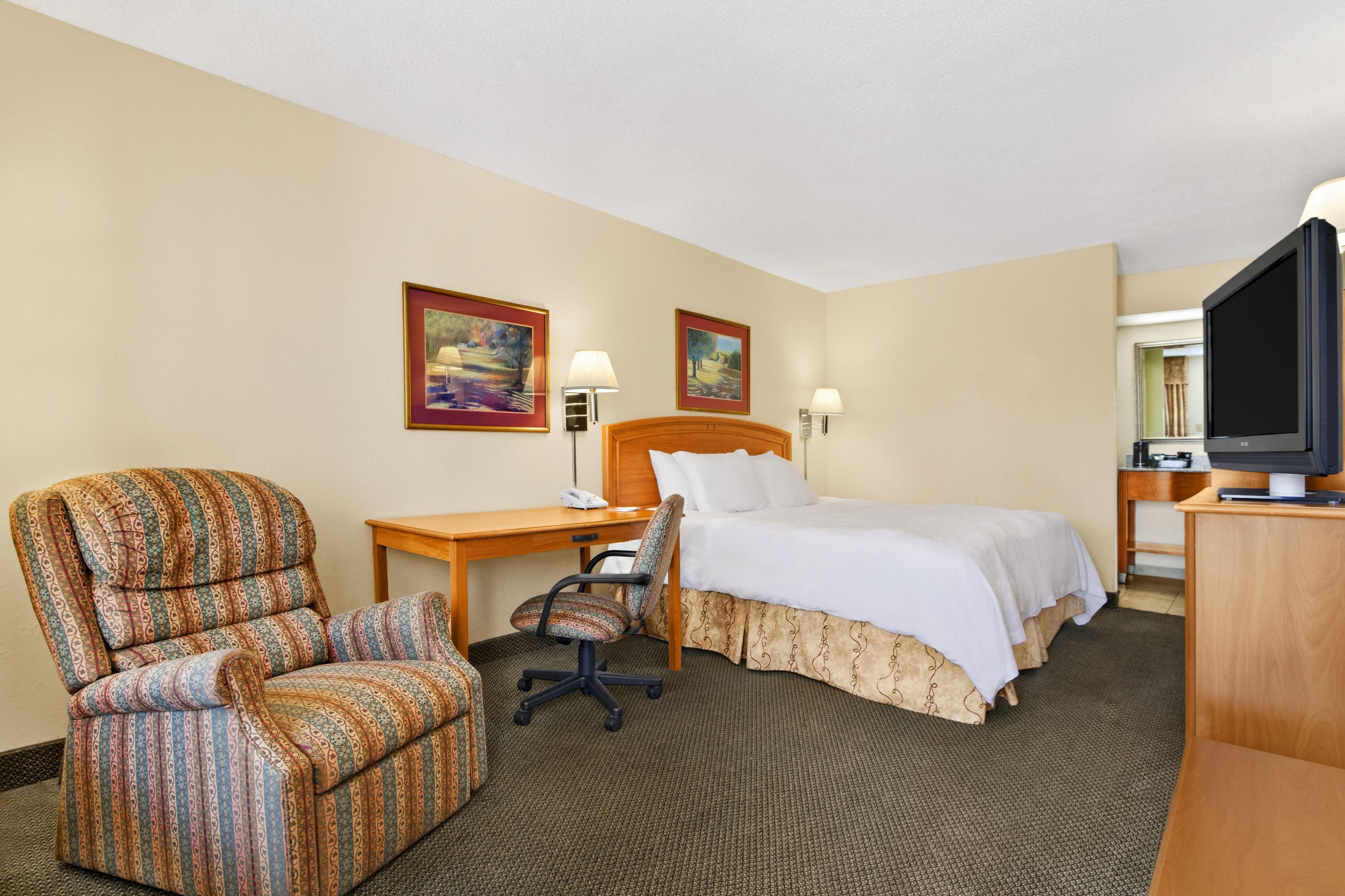 Guest room at the Howard Johnson by Wyndham Greensboro Near the Coliseum in Greensboro, North Carolina