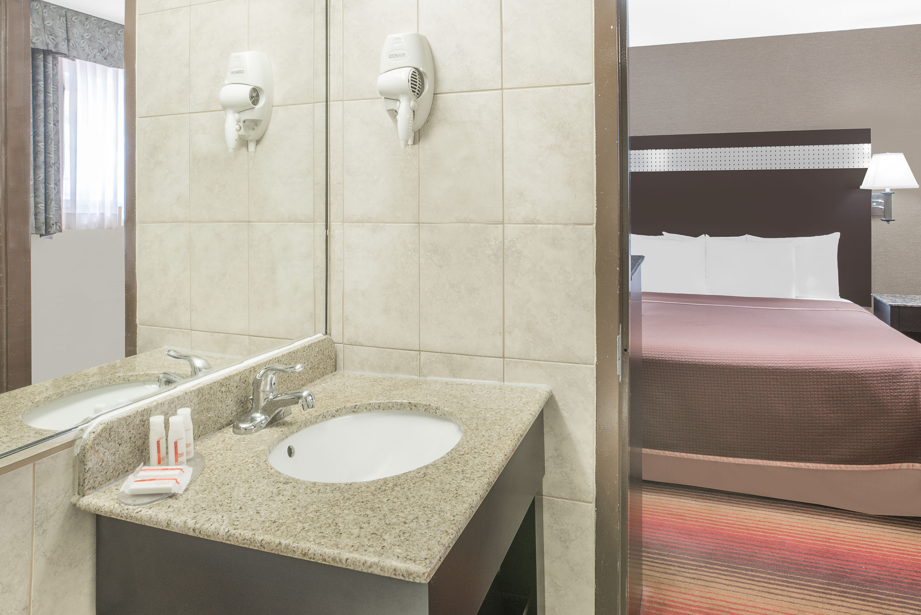 Guest room bath at the Howard Johnson by Wyndham North Bergen in North Bergen, New Jersey