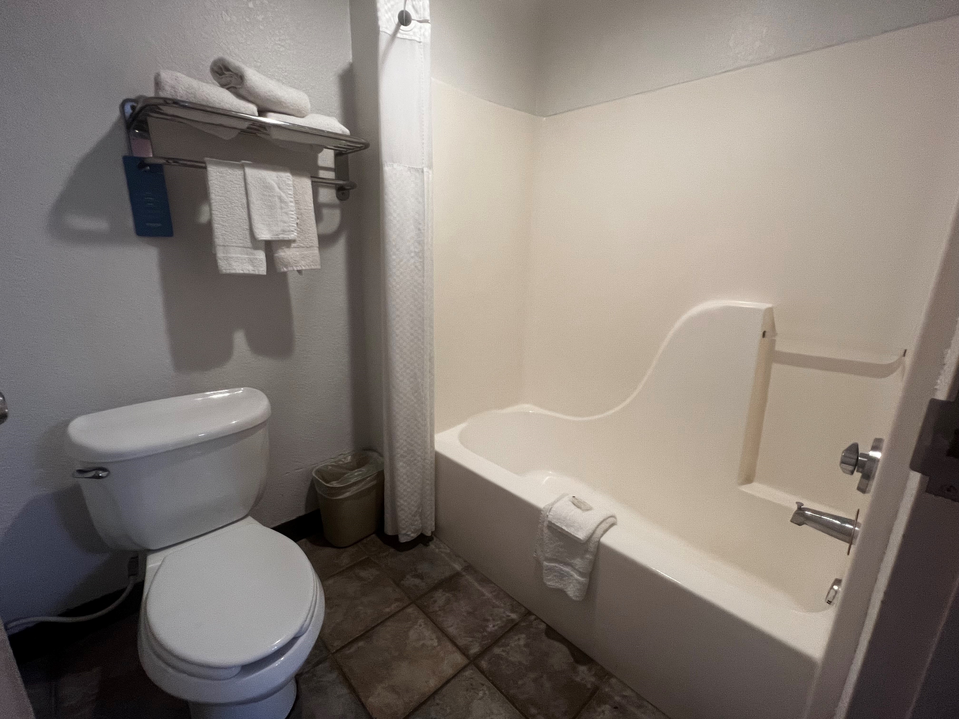 Guest room bath at the Howard Johnson by Wyndham Galveston in Galveston, Texas