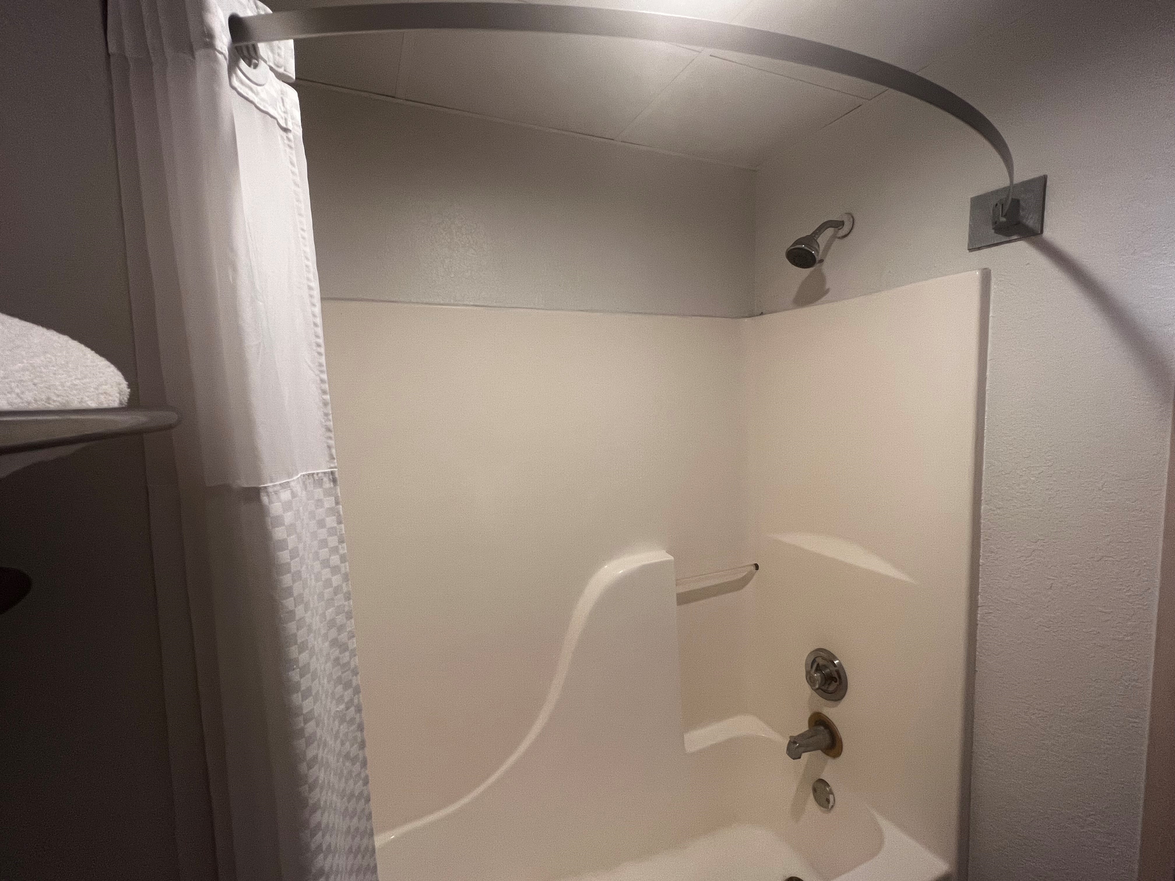 Guest room bath at the Howard Johnson by Wyndham Galveston in Galveston, Texas