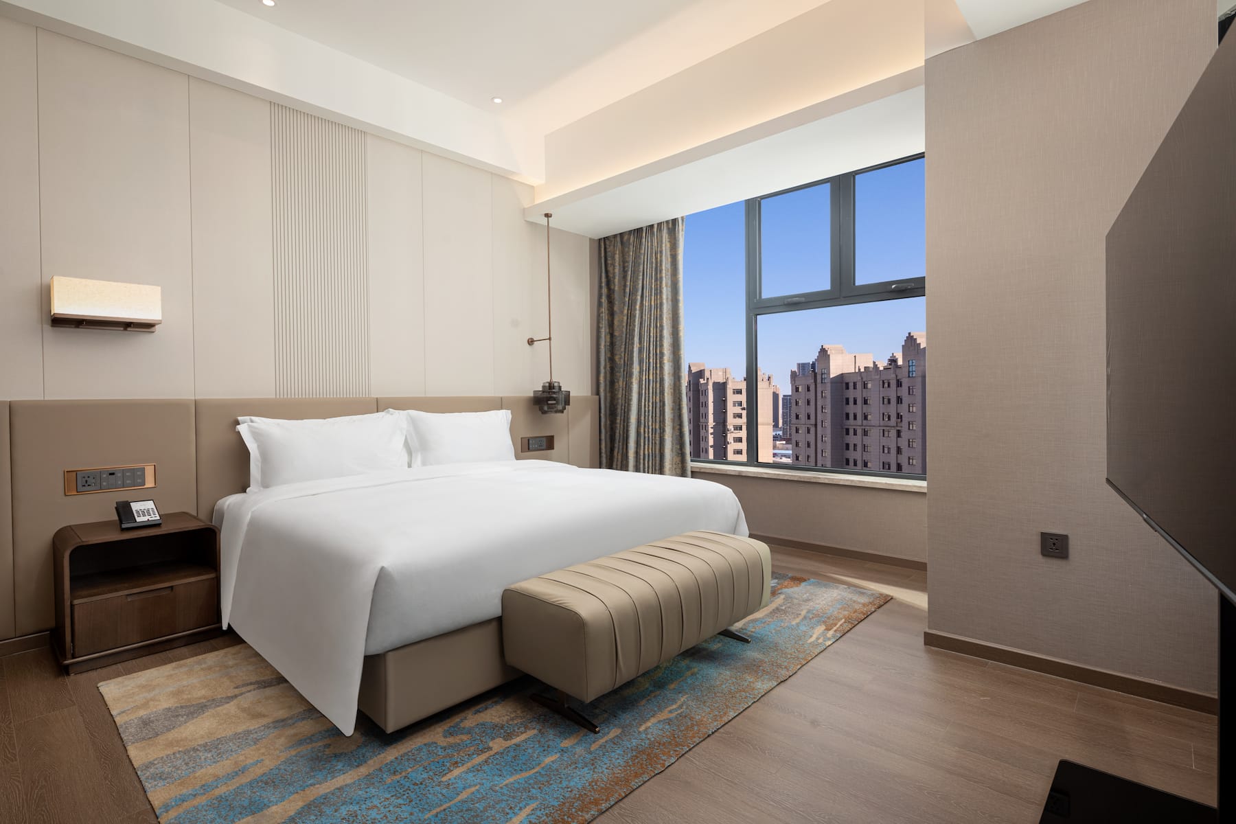 Guest room at the Wyndham Dalian Jinpu in Dalian, Other than US/Canada