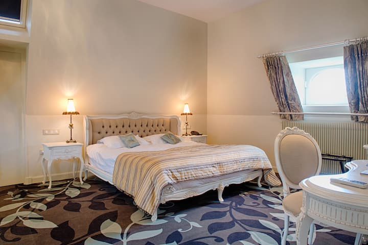 King bed guest room at the Wyndham Halcyon Resort La Souterraine in La Souterraine, Other than US/Canada