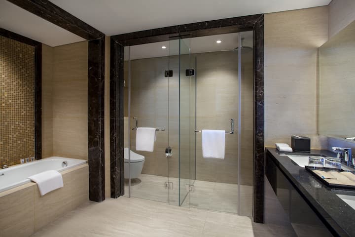 Guest room bath at the Wyndham Opi Hotel Palembang in Palembang, Other than US/Canada