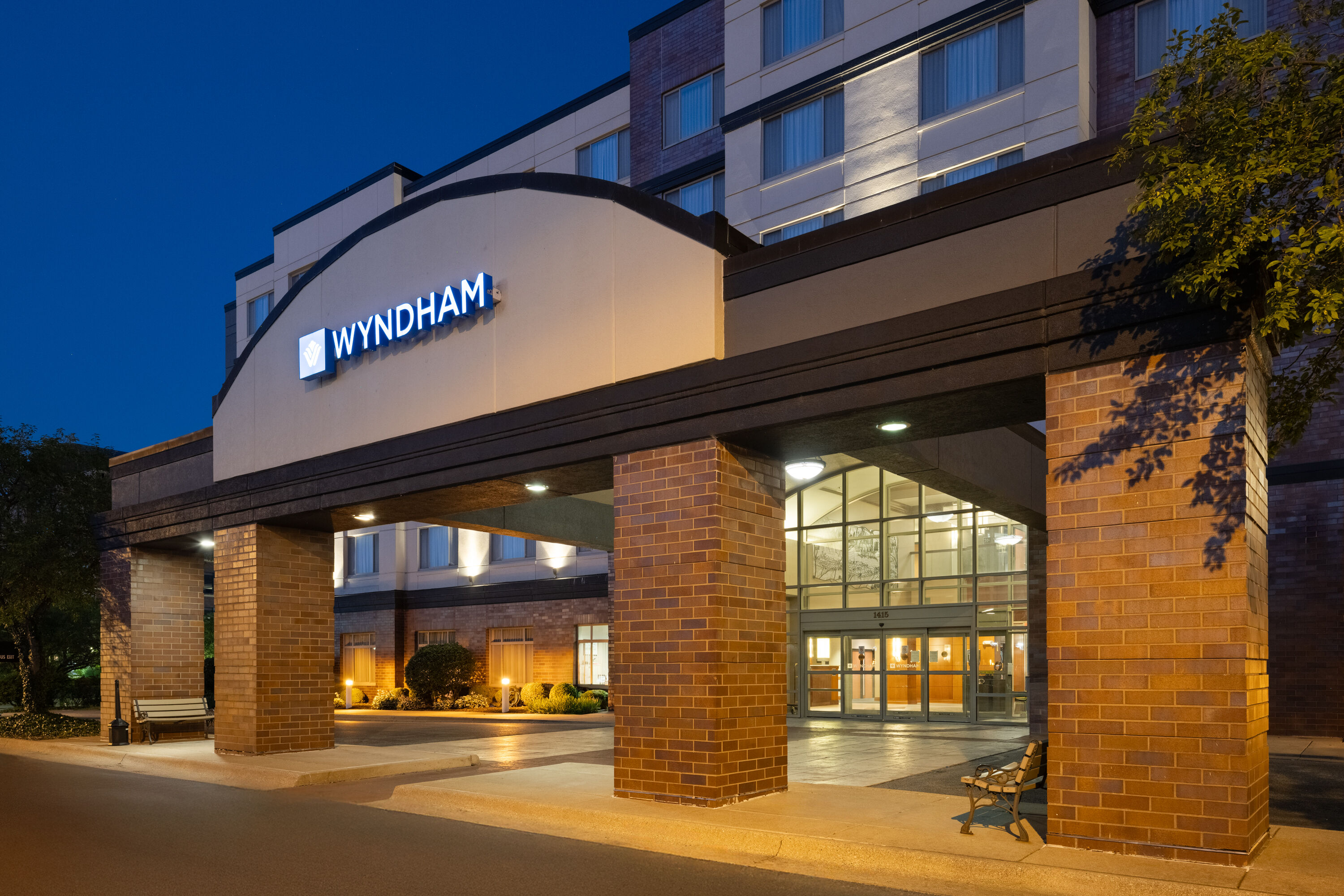 Exterior Dusk Image of Wyndham Moline on John Deere Commons hotel in Moline, Illinois