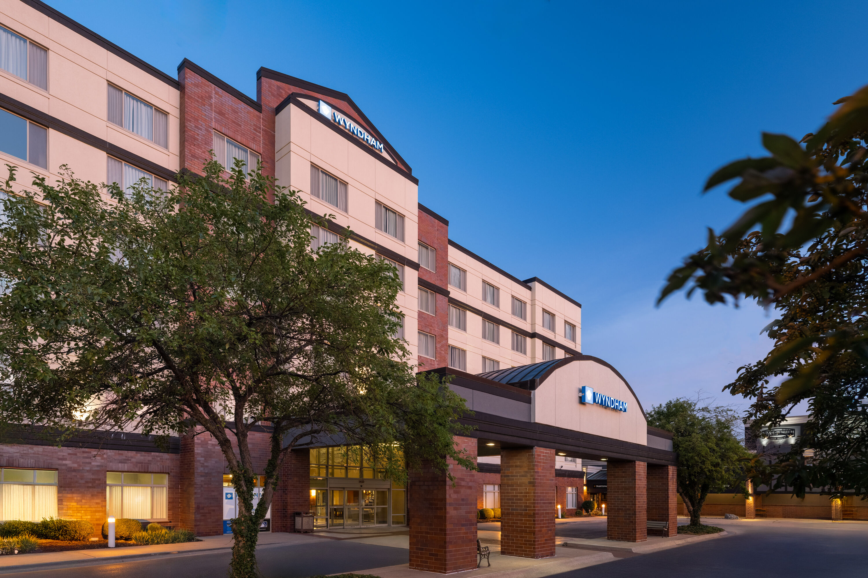 Exterior Dusk Image of Wyndham Moline on John Deere Commons hotel in Moline, Illinois