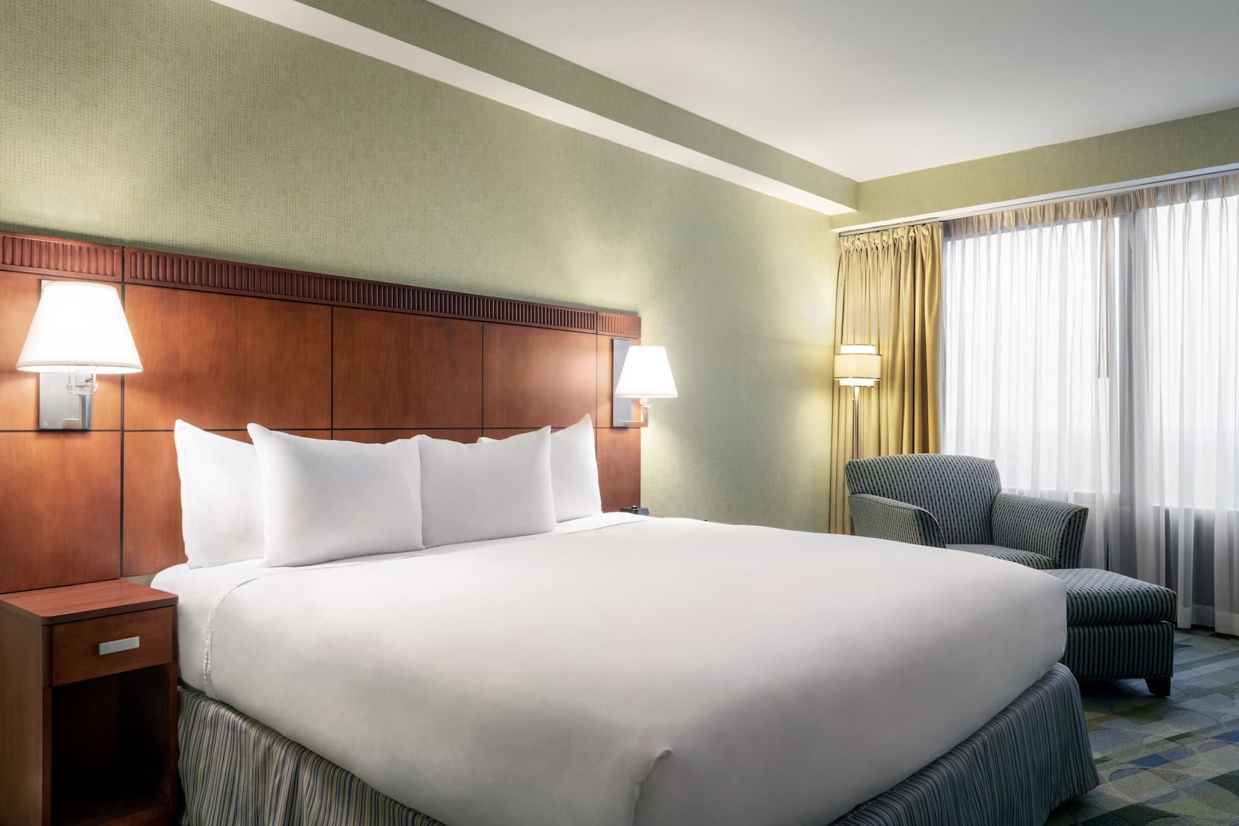 King bed guest room at the Wyndham Springfield City Centre in Springfield, Illinois
