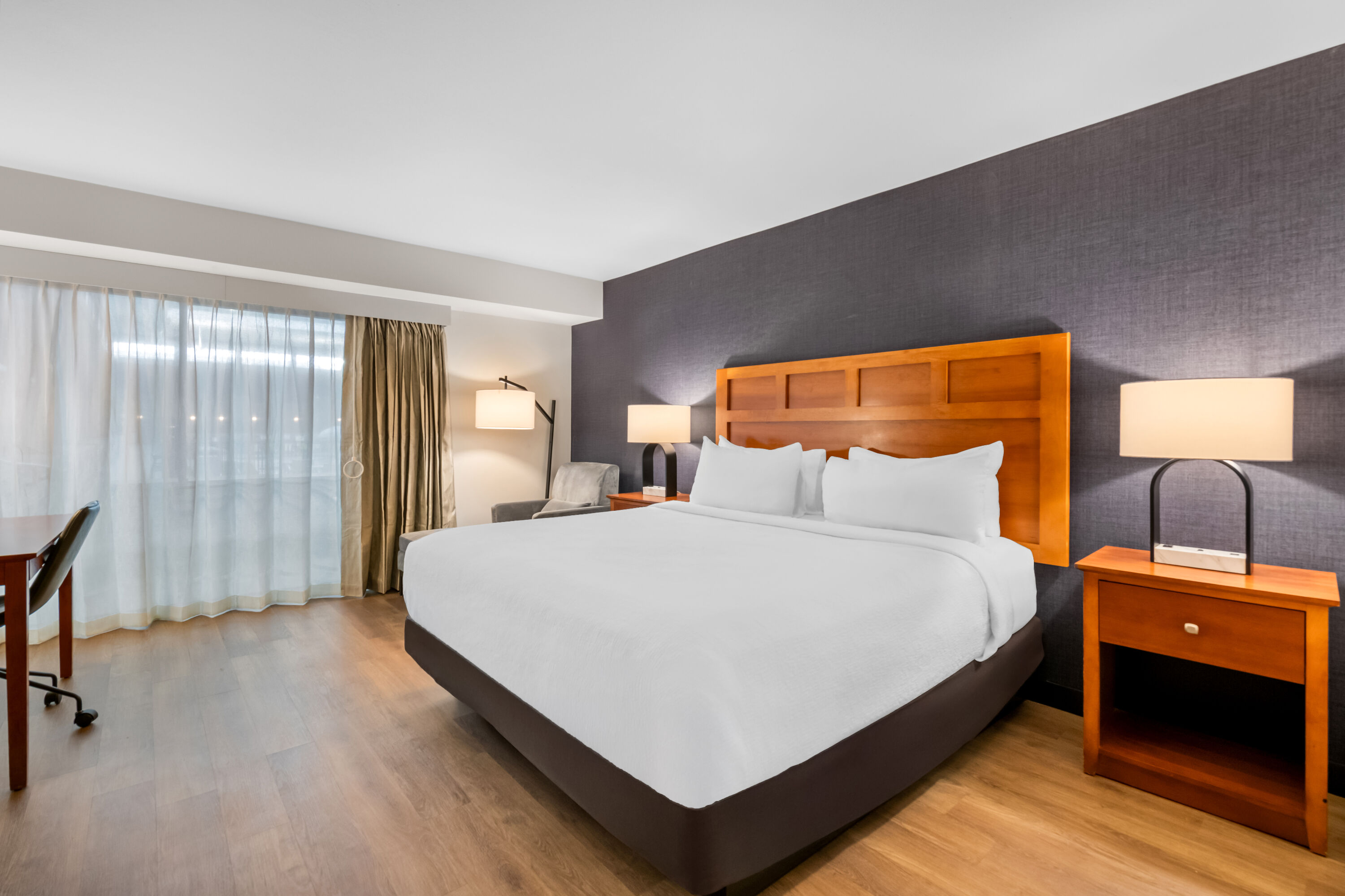 King bed guest room at the Wyndham Bloomington - Mall of America in Bloomington, Minnesota