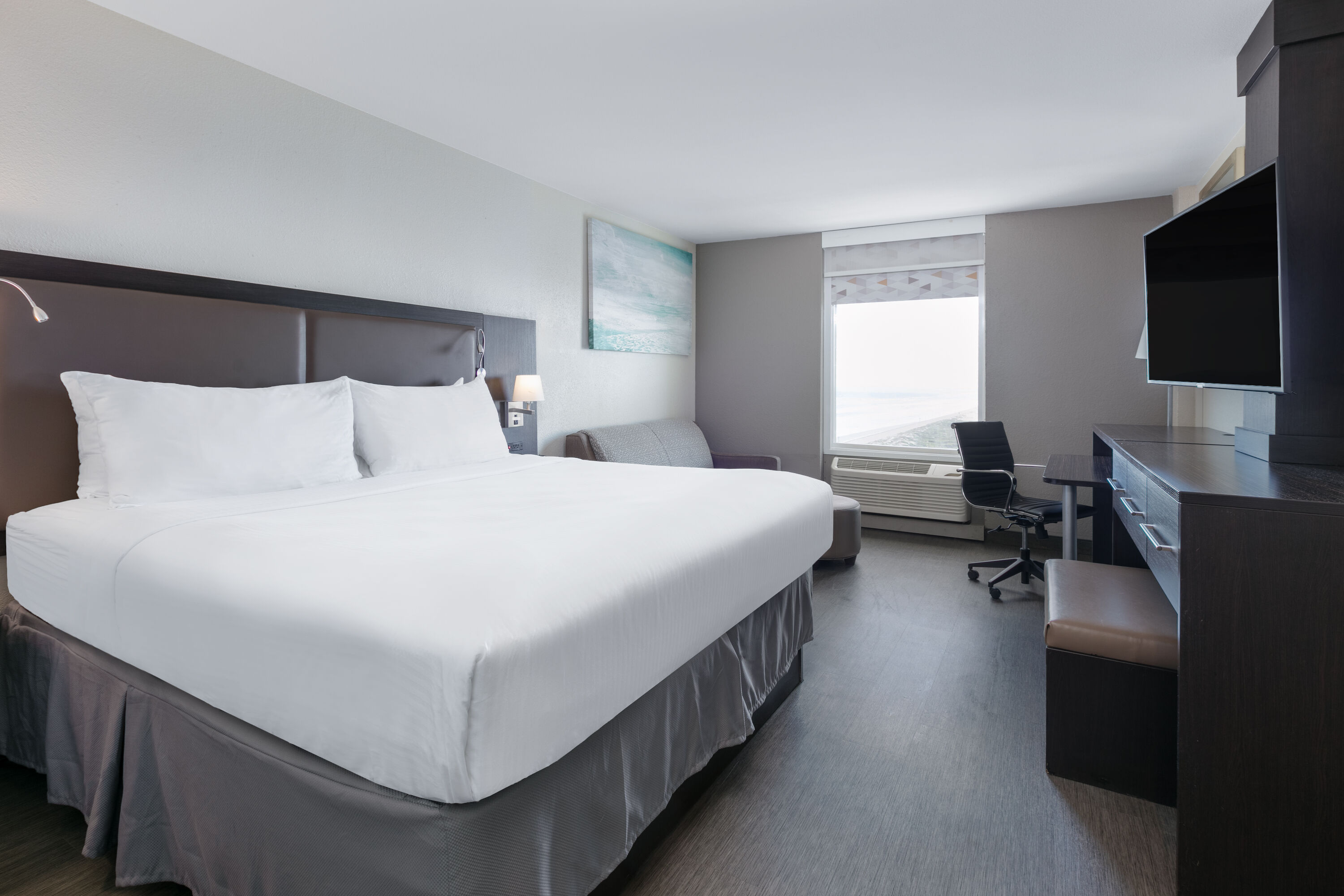 King bed guest room at the Wyndham Corpus Christi Resort North Padre Island in Corpus Christi, Texas